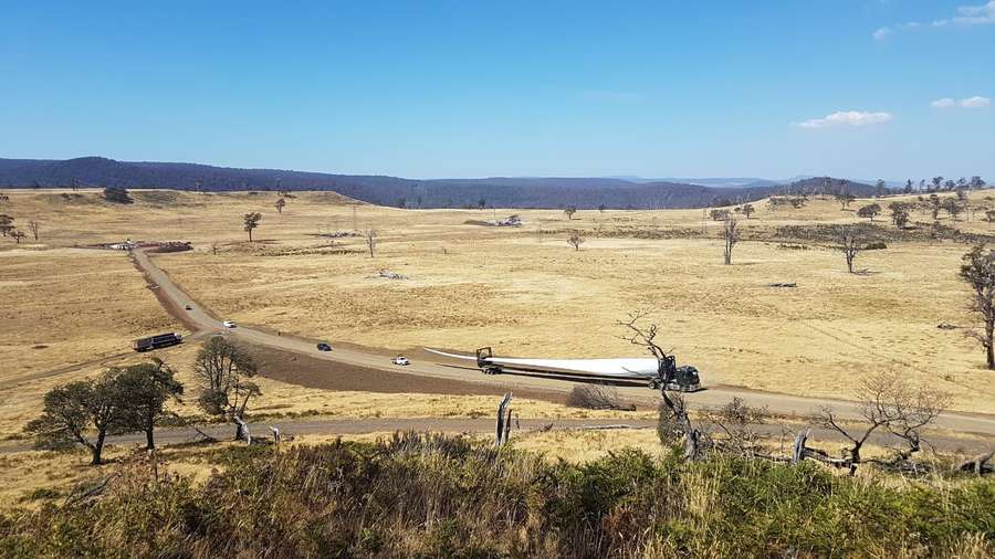 A truck transporting a turbine blade through the Central Highlands to the Cattle Hill Wind Farm