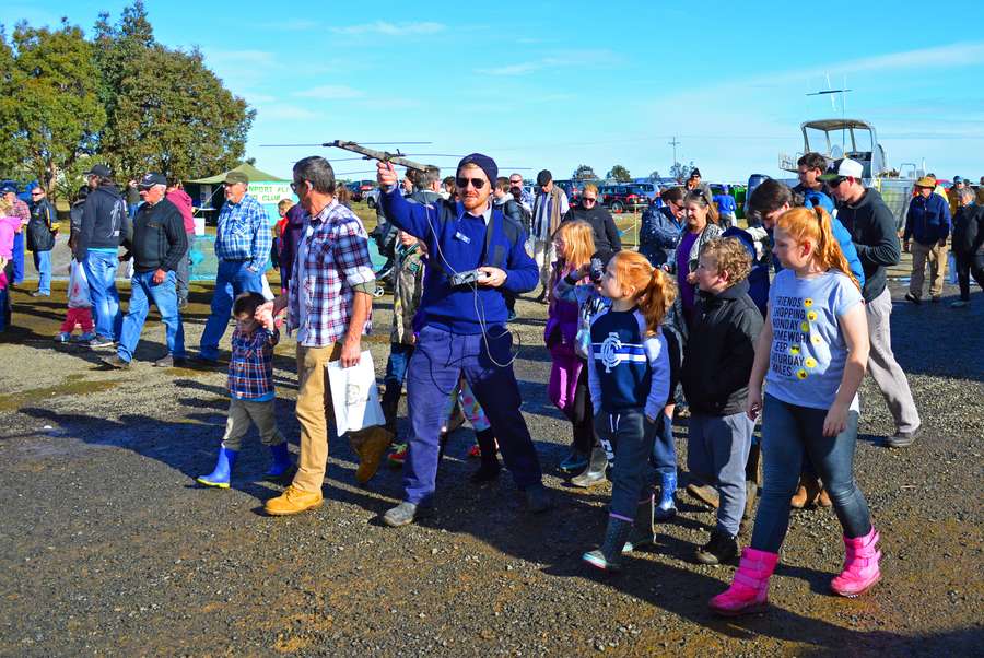 IFS Staff member, Chris Boon, demonstrating a carp radio tracking transmitter to families at Trout Weekend.