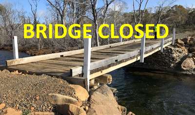 The Tumbledown Creek Bridge with the word 'closed' super imposed over the image.