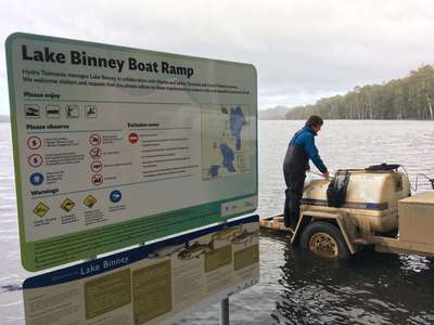 IFS work experience student, Jack, transferring wild adult brown trout into Lake Binney.