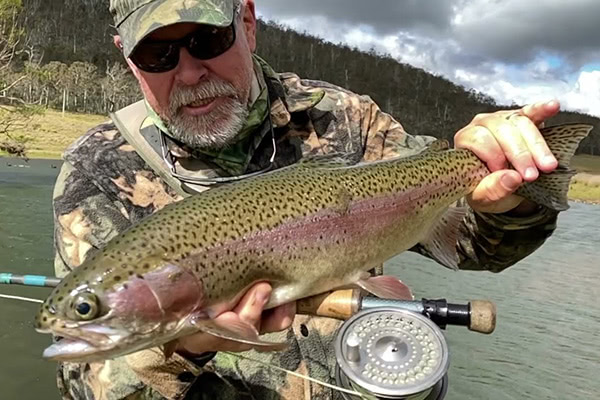 Steve Starling holding a rainbow trout
